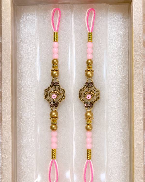 Fancy Golden Ganesha Pink Beads Rakhi