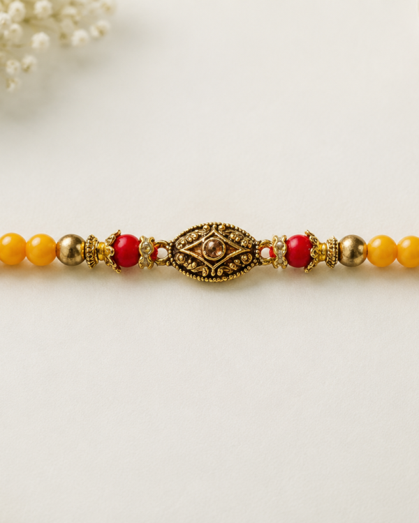 Fancy Golden Oval Stone Rakhi